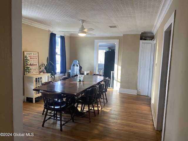 dining room featuring ceiling fan, dark hardwood / wood-style flooring, and crown molding