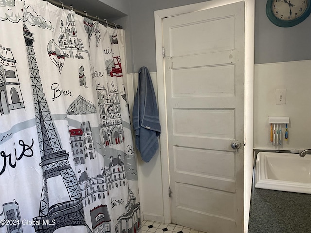 bathroom with a shower with curtain