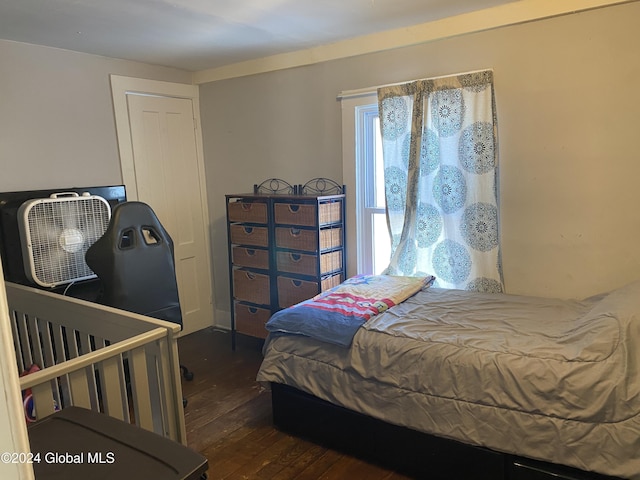 bedroom featuring dark hardwood / wood-style flooring