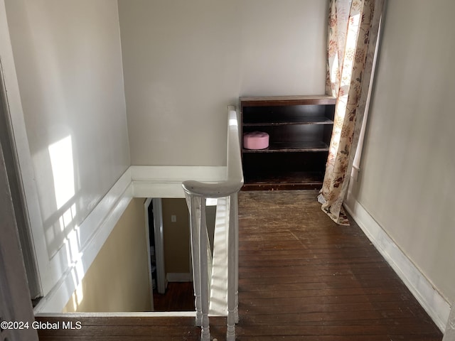 stairs with hardwood / wood-style floors