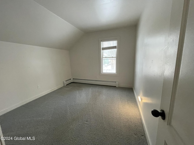 additional living space with carpet, a baseboard radiator, and lofted ceiling