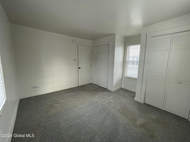 unfurnished bedroom with carpet