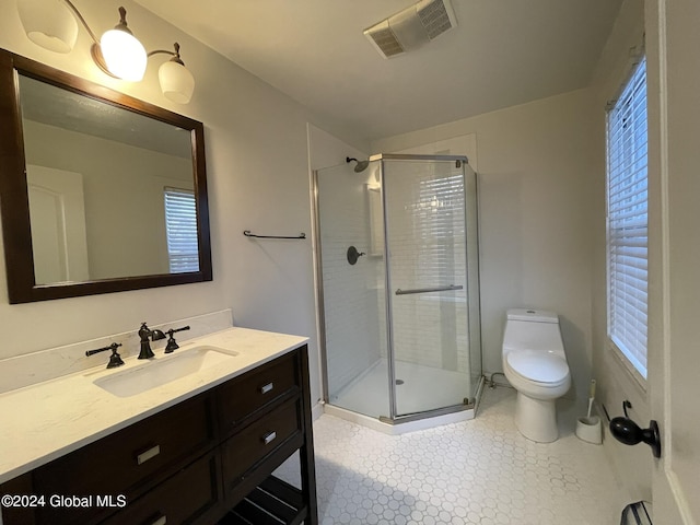 bathroom with plenty of natural light, an enclosed shower, and toilet