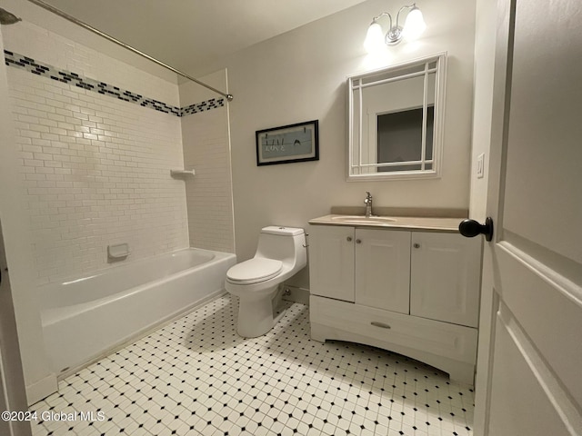 full bathroom with toilet, vanity, tile patterned floors, and tiled shower / bath combo