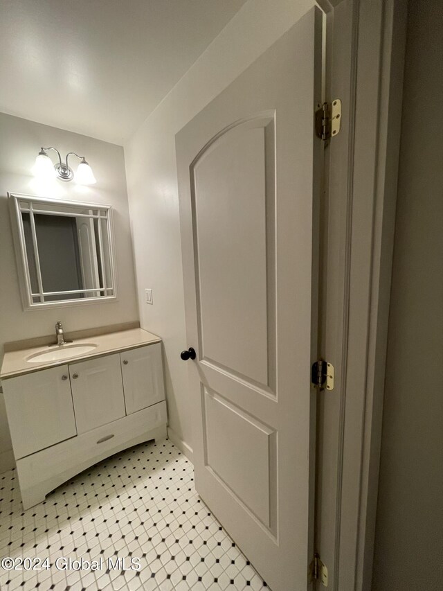 bathroom with tile patterned flooring and vanity