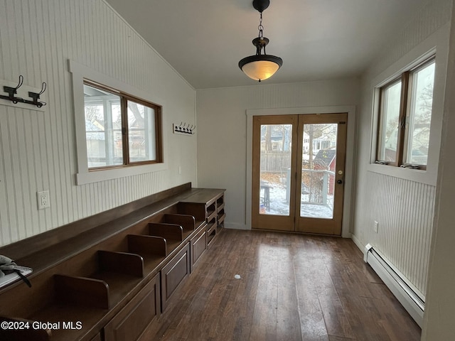 doorway with french doors, a baseboard radiator, vaulted ceiling, and dark wood-type flooring