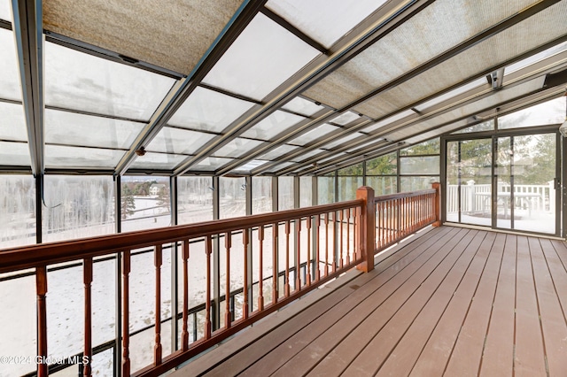 unfurnished sunroom with lofted ceiling