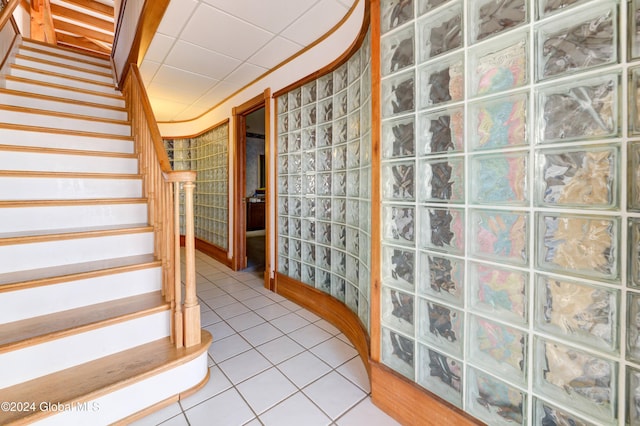 stairs featuring tile patterned floors