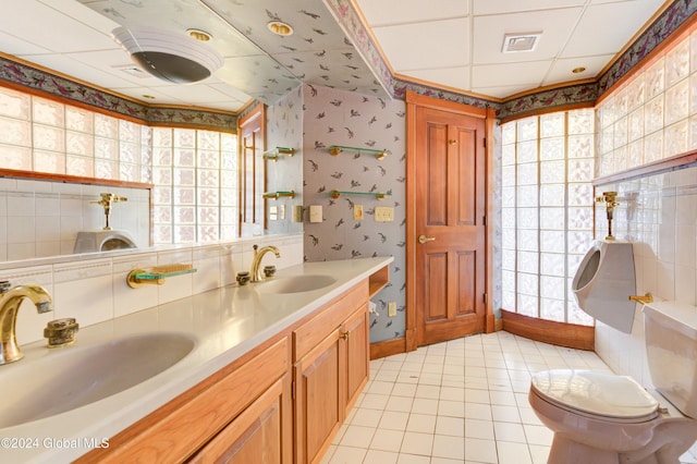 bathroom featuring toilet, vanity, and tile patterned floors