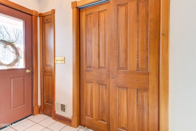 foyer entrance with light tile patterned floors