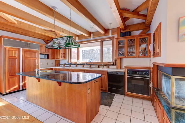 kitchen with a center island, beamed ceiling, decorative light fixtures, a breakfast bar, and black appliances