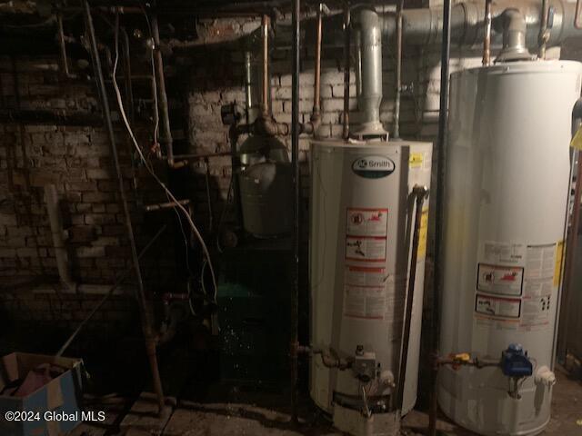 utility room with gas water heater