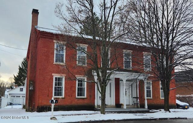 colonial-style house featuring a garage