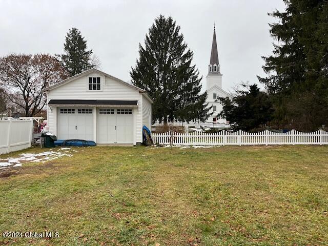 view of yard with an outbuilding and a garage