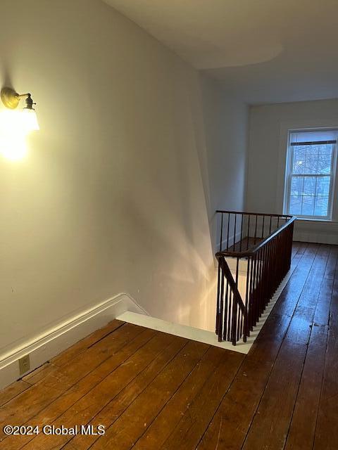 stairs with wood-type flooring