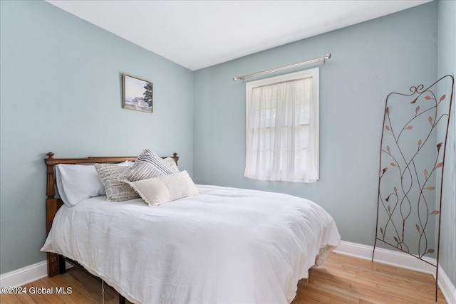 bedroom with light hardwood / wood-style flooring