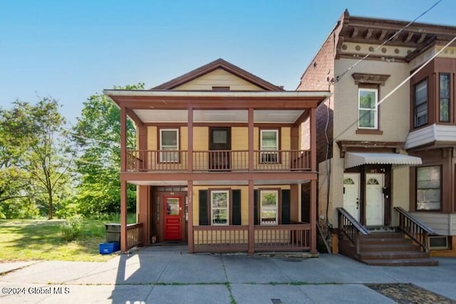 view of front of property with a balcony