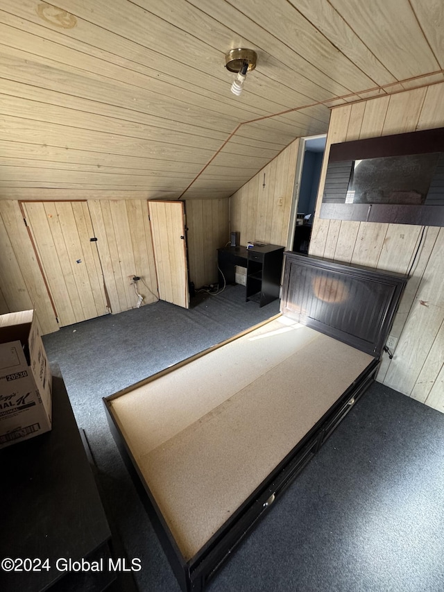 bonus room featuring wooden walls, lofted ceiling, and wood ceiling