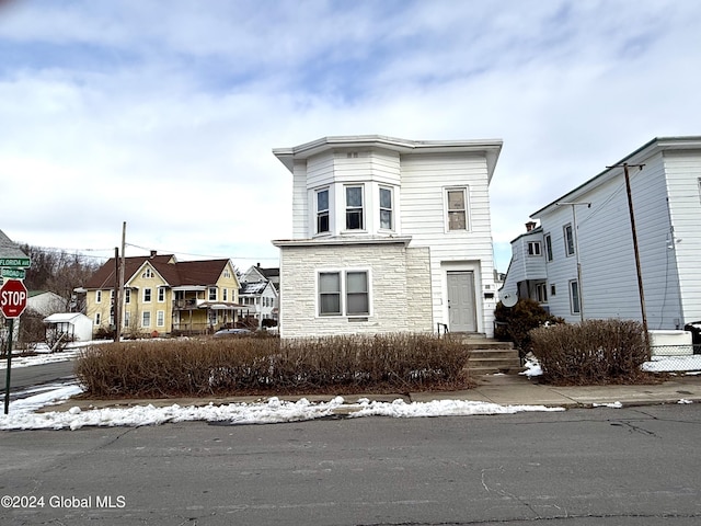 view of front of home with stone siding and a residential view