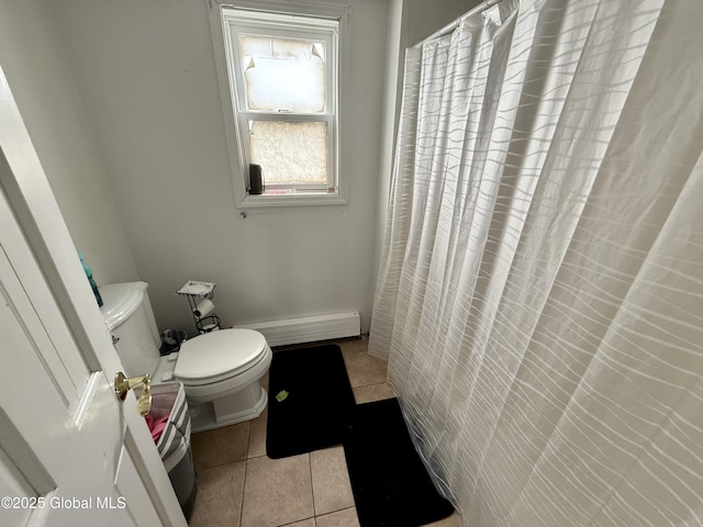 full bath with a baseboard heating unit, toilet, and tile patterned floors