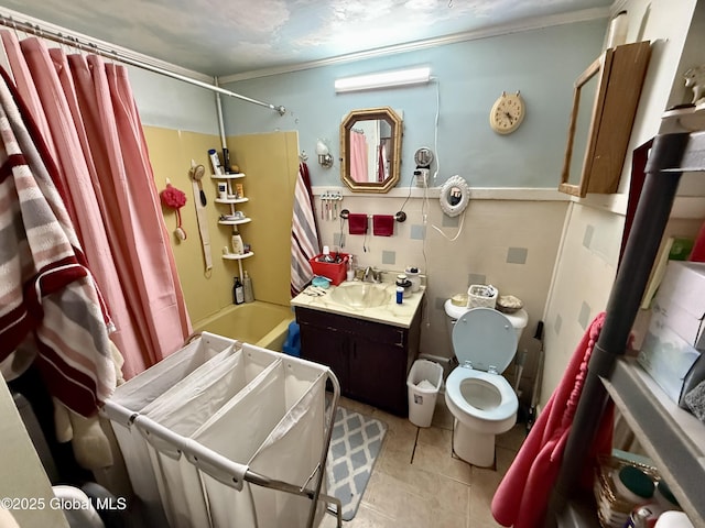 bathroom with tile patterned flooring, vanity, toilet, and shower / bathtub combination with curtain