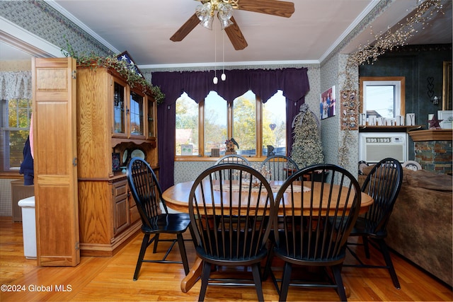 dining space with light wood-type flooring, ceiling fan, and ornamental molding