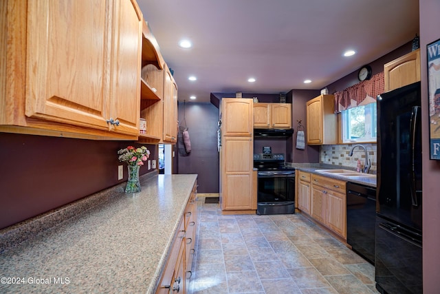 kitchen with decorative backsplash, light stone counters, sink, black appliances, and light brown cabinets