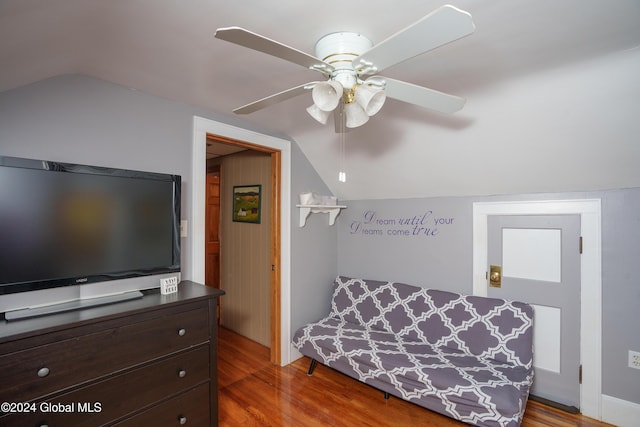 bedroom with hardwood / wood-style floors, ceiling fan, and lofted ceiling