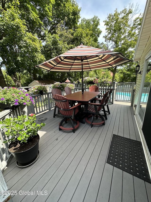 wooden terrace with a pool