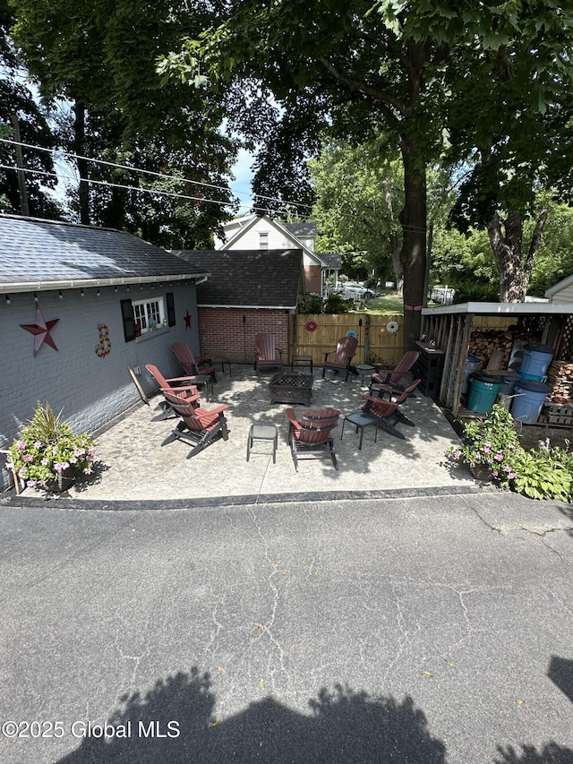 exterior space with a fire pit and a patio area