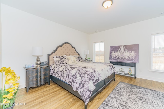 bedroom with wood-type flooring