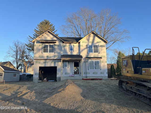 unfinished property with a garage