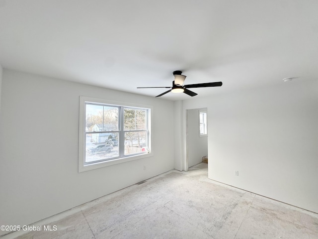 unfurnished room featuring ceiling fan