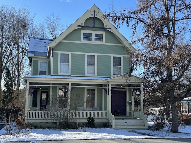 victorian-style house featuring covered porch