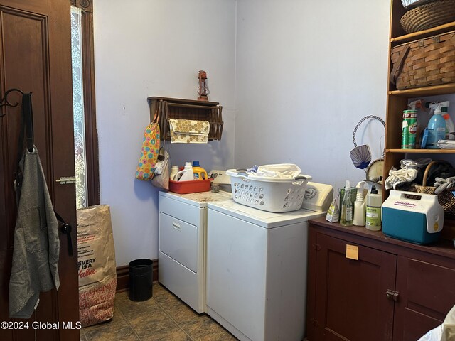 washroom with washer and dryer and cabinet space