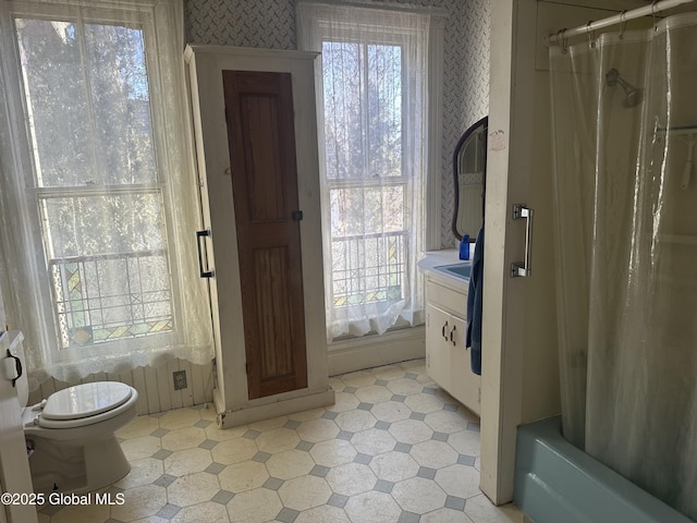 full bathroom featuring tile patterned floors, toilet, wallpapered walls, and vanity