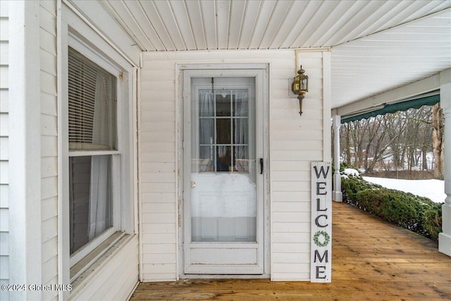 view of snow covered property entrance