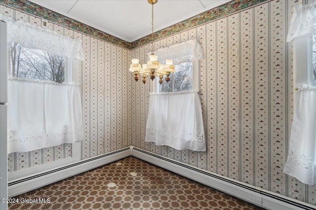 unfurnished dining area with baseboard heating and an inviting chandelier