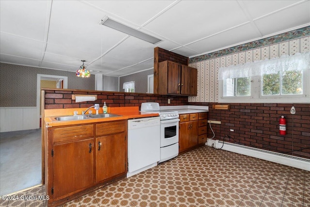 kitchen with white appliances, baseboard heating, a paneled ceiling, and sink