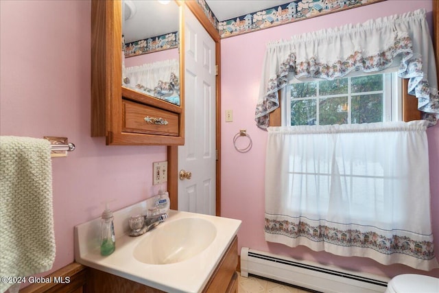 bathroom featuring vanity and a baseboard heating unit