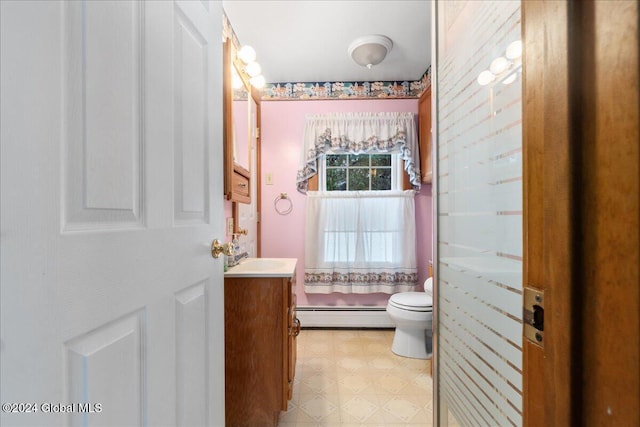 bathroom featuring a shower with shower curtain, vanity, toilet, and a baseboard heating unit