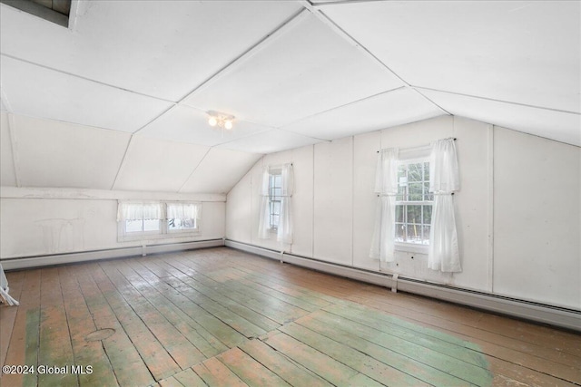 bonus room featuring wood-type flooring and vaulted ceiling