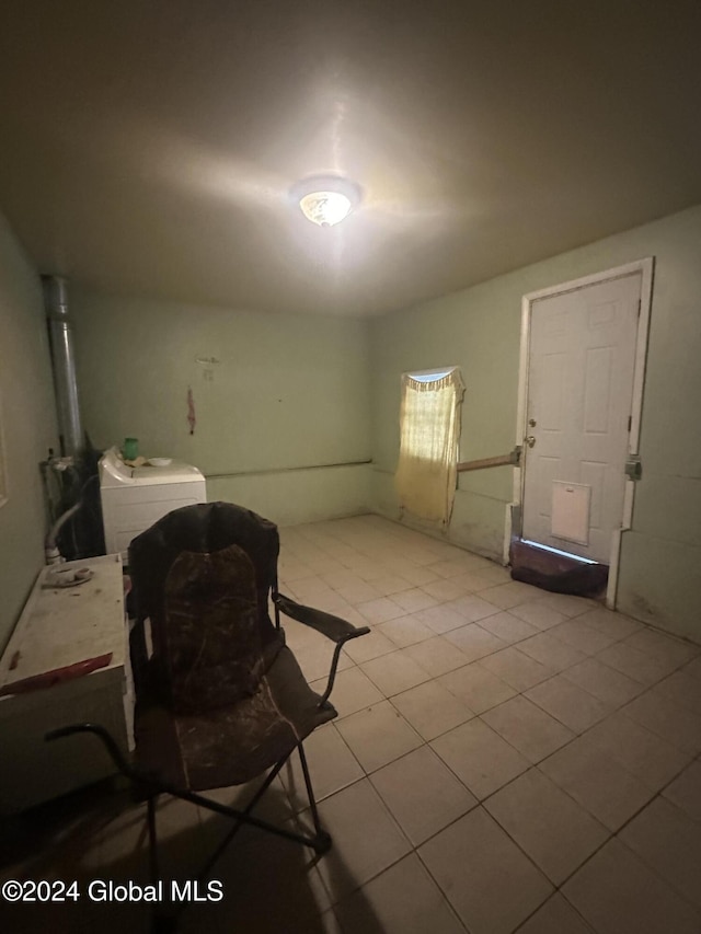 interior space with washer / dryer and light tile patterned floors