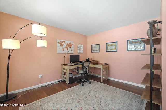 home office featuring wood finished floors and baseboards