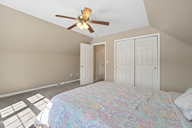 bedroom with lofted ceiling, a ceiling fan, a closet, carpet floors, and baseboards