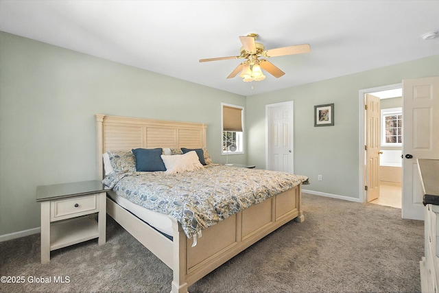 carpeted bedroom featuring connected bathroom, baseboards, and ceiling fan