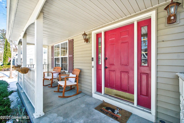 entrance to property featuring a porch