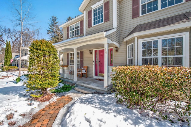 doorway to property with covered porch