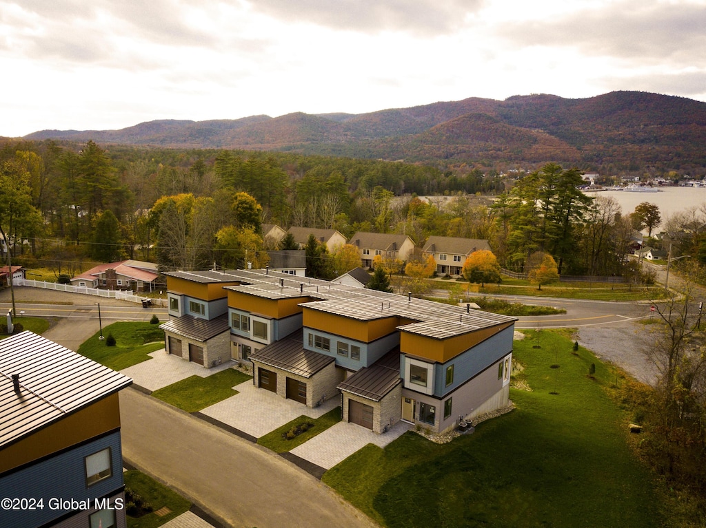 drone / aerial view featuring a residential view and a mountain view