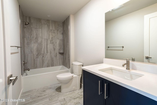 bathroom featuring washtub / shower combination, vanity, and toilet